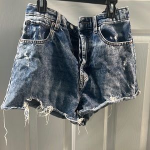 Medium Wash Shorts with a Button Up Close